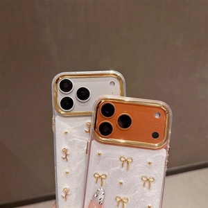 Detail of white marble iPhone case with 3D gold rose and bow-knot metallic accents