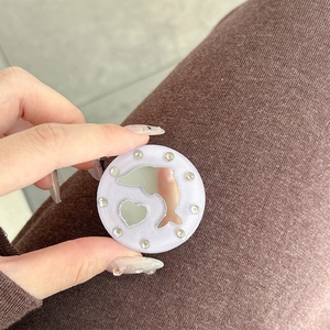 Close-up of heart and dolphin mirror phone grip with sparkling rhinestones decoration