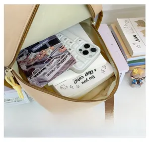 Detailed internal view showing the large capacity of this cute beige canvas backpack