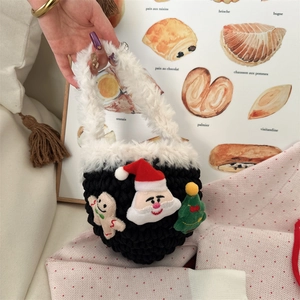Detail of handmade crochet Christmas mini bag with plush white fur and festive charms