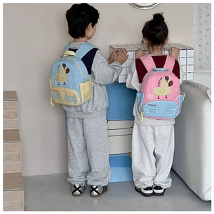 Close-up of kids backpack side mesh pocket and cute yellow duck embroidery details