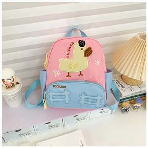 Close-up of cute yellow duck embroidery on pink and blue colorblock kids backpack