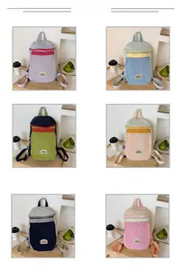 Color display of lightweight canvas backpacks with mountain logo for kids and outdoor travel