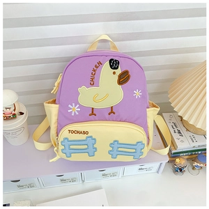 Detail of cute purple and yellow toddler backpack with cartoon chicken embroidery