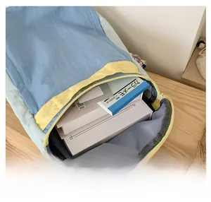 Detail shot of the large capacity interior of a lightweight blue kids backpack for school