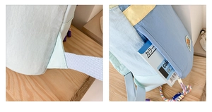 Detail of reinforced shoulder straps and side pockets on a colorful nylon kids backpack