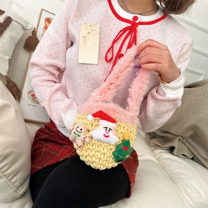 Handmade knitted Christmas mini tote bag for kids with Santa and Gingerbread Man charms