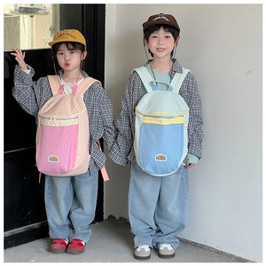 Detail of children's lightweight backpack with dual shoulder straps and bicolor design