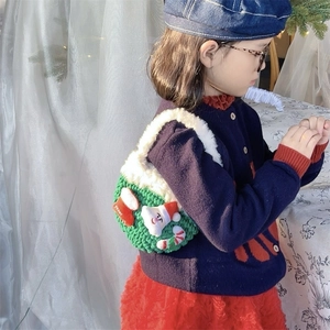 Handmade knitted Christmas basket bag with green yarn and white faux fur trim for kids