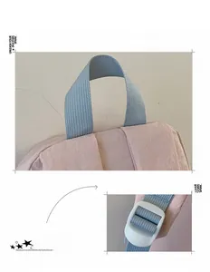 Detailed view of durable woven top handle and white adjustable buckle on student backpack