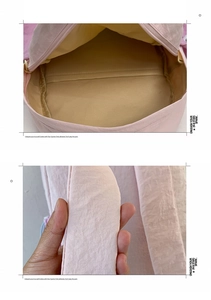 Detail view of pink school bag showing large interior storage and thick padded shoulder straps