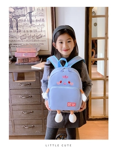 Detailed view of large capacity cartoon kids backpack with cute blue face design