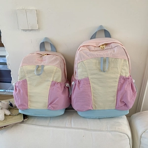 Detailed comparison of macaron color-block schoolbags in large and small sizes