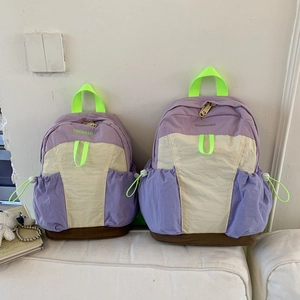 Comparison of two sizes of large capacity colorblock nylon backpacks for primary school students
