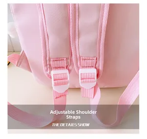 Detail of pink school backpack featuring adjustable wide shoulder straps and durable buckles