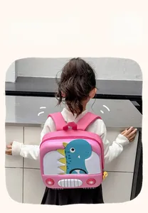Detailed back view of pink lightweight dinosaur shell backpack worn by a toddler child