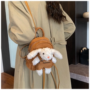 Mini brown suede backpack featuring a cute white plush bunny doll with thin leather straps