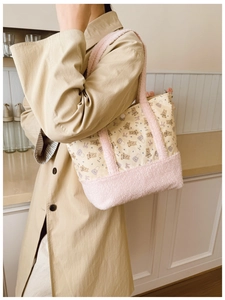 Detail showing plush fleece stitching and cute bear print on a yellow canvas kids tote bag