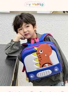 Detail of a 3D cartoon dinosaur backpack for toddlers on a boy model back