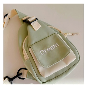 Detail of Korean style kids crossbody bag showing Dream embroidery and adjustable strap