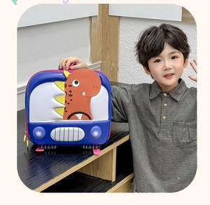 Detail of 3D dinosaur hard shell toddler backpack with smooth red zipper and top handle