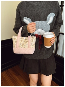 Detail of pink plush bear print tote bag with soft faux shearling and canvas handles
