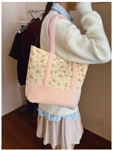 Detail of cute bear canvas tote bag with pink plush shoulder strap and snap closure