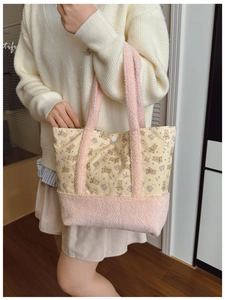 Detail of cute bear print canvas tote with pink plush faux fur trim and handles