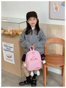Pink cartoon kids backpack with 3D cute features and waterproof nylon fabric detail