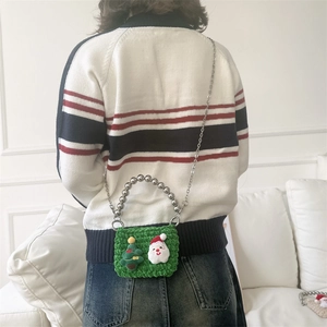 Kids green knit Christmas crossbody bag with Santa Claus, tree motifs and beaded handle