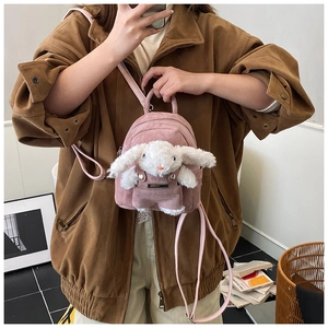 Pink corduroy mini backpack for kids featuring a cute plush bunny with long ears