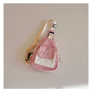 Detail of pink and white canvas crossbody bag with Dream letter embroidery for kids