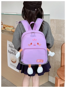 Detail of purple cartoon schoolbag with cute 3D plush limbs and durable nylon texture