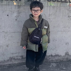 Kid's black canvas chest bag with white Dream lettering and stylish buckle strap design