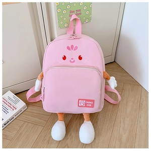 Close-up of pink school backpack with 3D cartoon plush limbs and embroidery detail