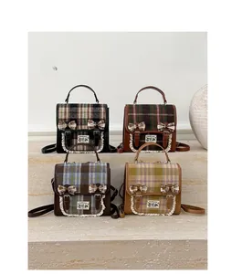 Selection of four plaid school backpacks with bows and vintage lace detailing