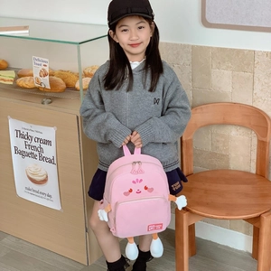 Pink cartoon school backpack with cute 3D arms and legs for elementary school girls