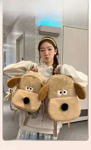 Detail of plush cartoon puppy backpack showing soft brown faux fur and large floppy ears