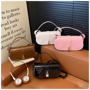 Collection of patent leather shoulder bags in white, pink, brown, and black colors