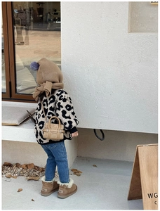 Toddler winter outfit with leopard faux fur jacket, beige mini handbag and UGG boots