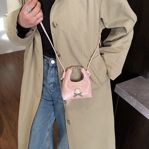 Pink mini bear crossbody bag with bow for little girls featuring a soft plush charm