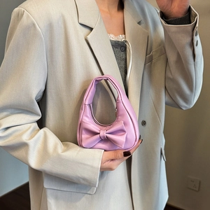 Pink mini girls handbag with sweet bow design, stylish kids fashion accessory