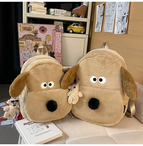 Detail of plush cartoon dog backpack with long ears and soft brown fur texture