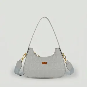 Light gray quilted hobo bag with gold hardware and dual adjustable shoulder straps