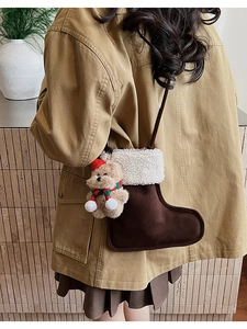 Detail of Christmas stocking crossbody bag featuring cute plush bear and fuzzy texture