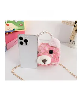 Plush bear bag for kids with pearl handle and chain compared with a smartphone size