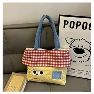 Detail of cute contrast color kids tote bag with cartoon embroidery and checkered pattern