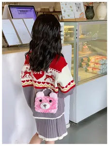 Detailed back view of pink plush bear crossbody bag with pearl handle and chain strap