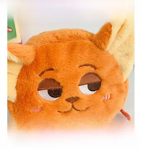 Close-up of fluffy orange cartoon fox plush bag featuring delicate embroidered facial details