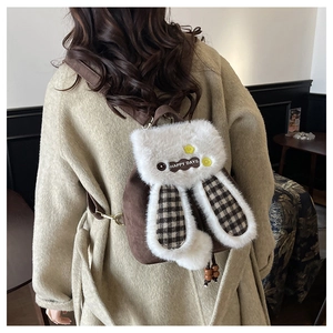 Detail of plush bunny backpack with cute long ears, plaid lining and Happy Days print